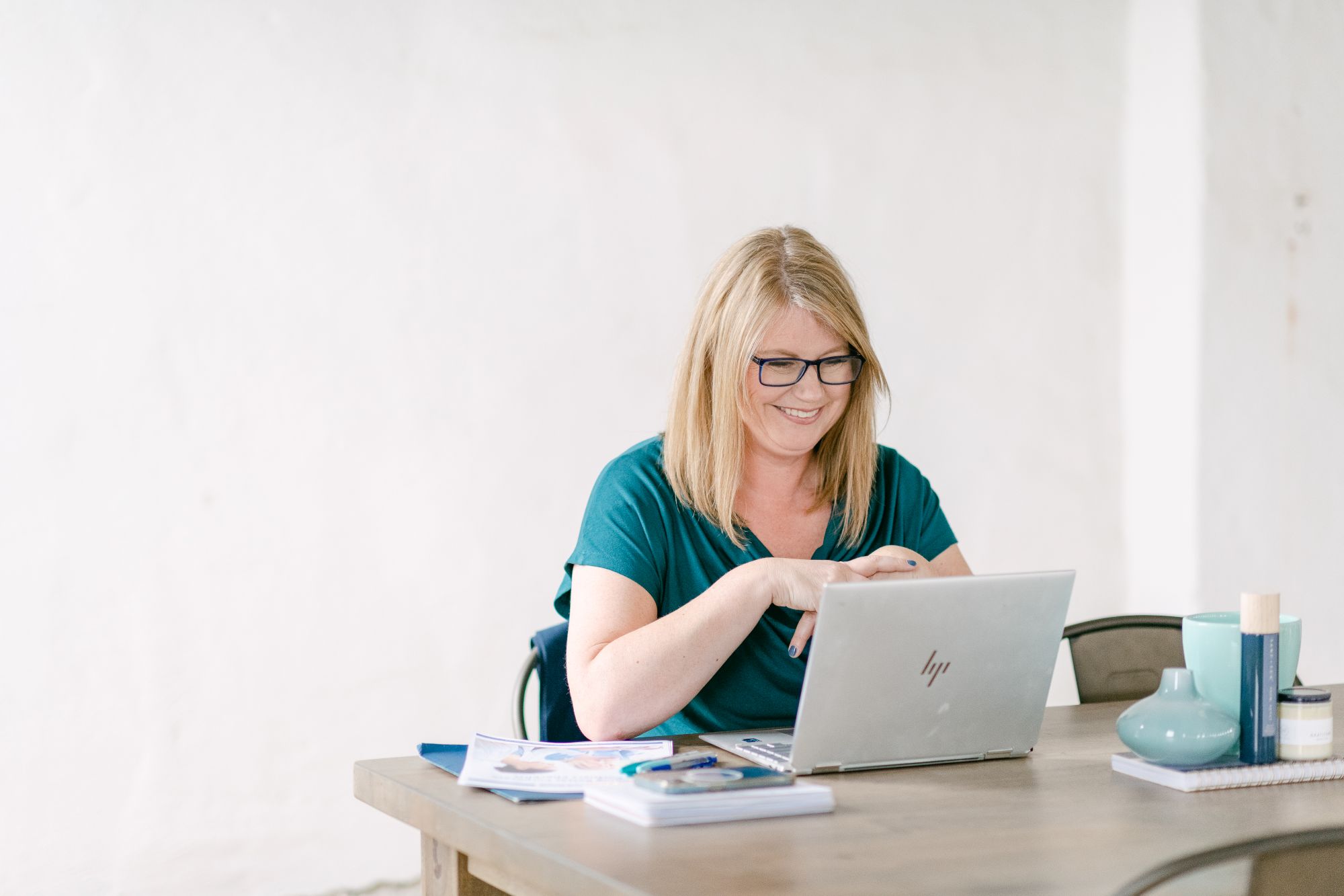 Heather working in front of her laptop