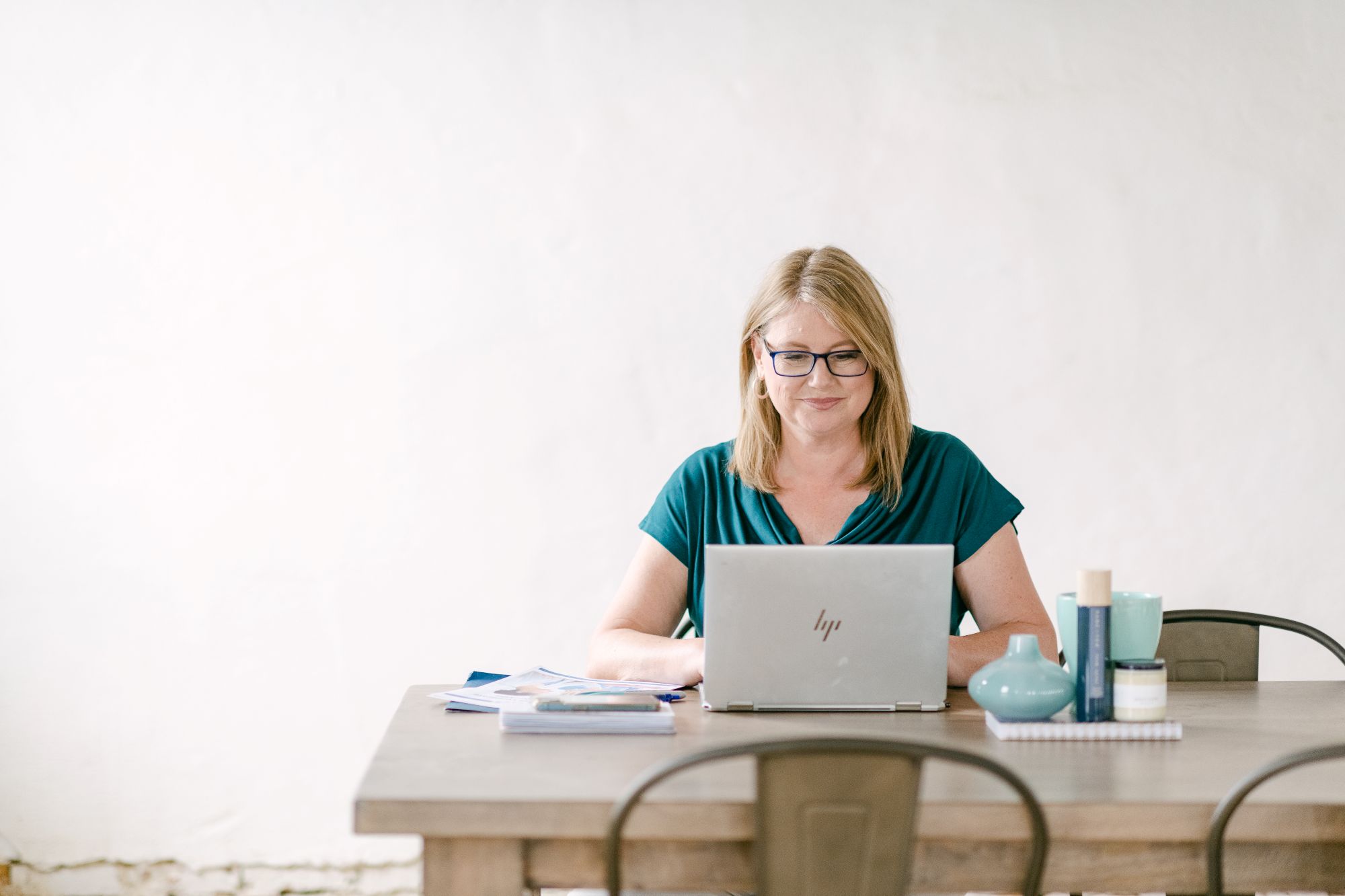 Heather working on her laptop