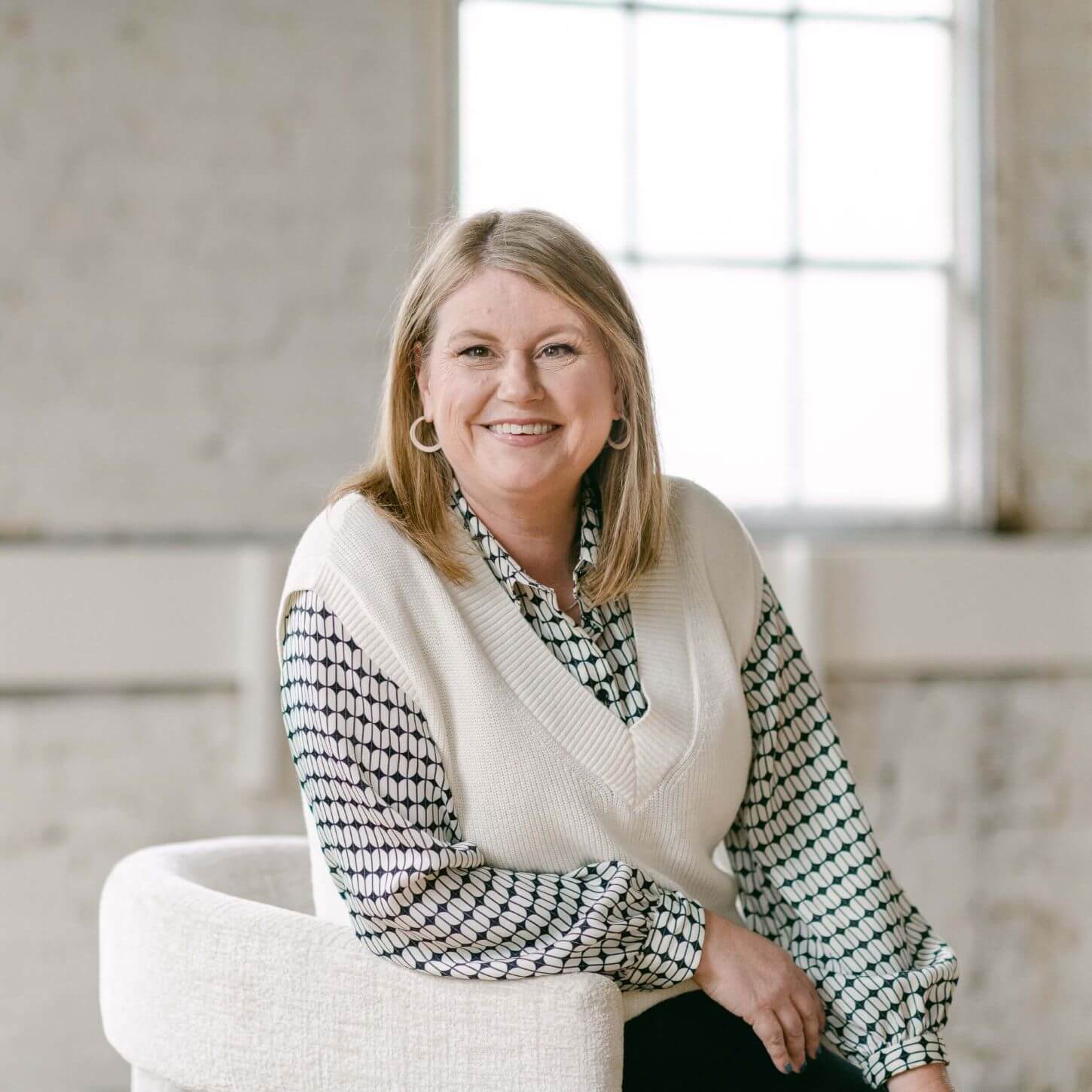Heather seated and smiling